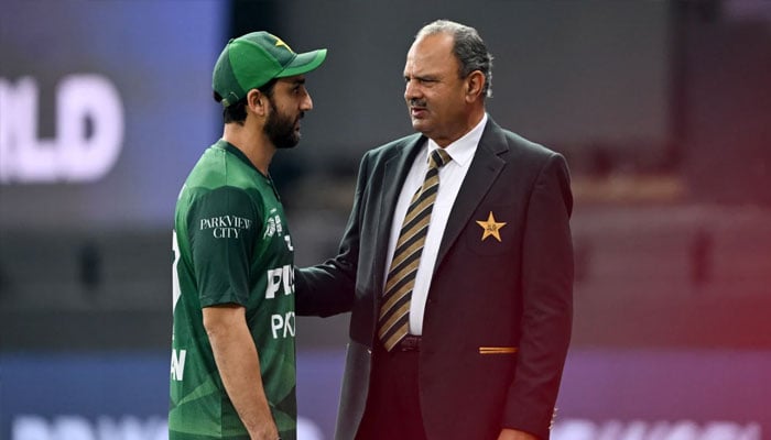 Pakistan captain Salman Agha speaks with team manager, Naveed Akram Cheema, ahead of Asia Cup match against the United Arab Emirates at Dubai International Cricket Stadium, Dubai, United Arab Emirates, September 17, 2025. — AFP