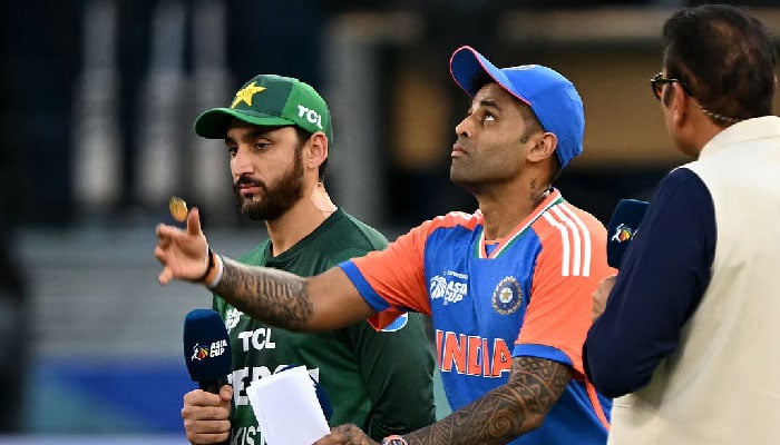 Indias captain Suryakumar Yadav (centre) tosses the coin at the start of the Asia Cup match against Pakistan in Dubai.. Photo: AFP