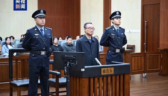 Former Chinese minister Tang Renjian stands in the court.— Shangai Daily