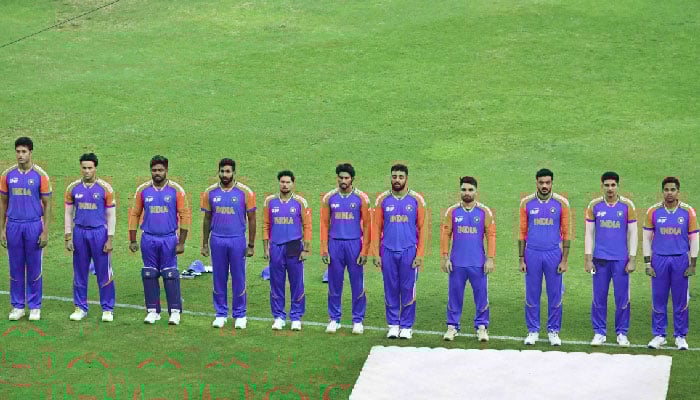 Indias players stand for their national anthem before the start of the Asia Cup 2025 final match between India and Pakistan at the Dubai International Stadium in Dubai on September 28, 2025. — AFP