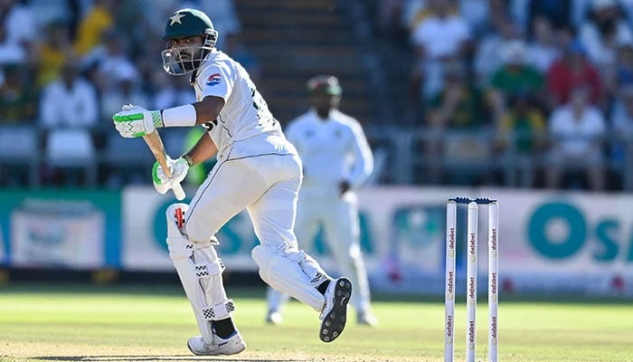 1349246_9991532_2_updates Pakistan´s Babar Azam watches the ball after playing a shot during the second day of the second Test cricket match between South Africa and Pakistan at Newlands stadium in Cape Town on January 4, 2025. — AFP