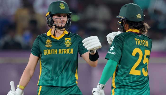 South Africas Laura Wolvaardt, Chloe Tryon fist-bumping during the ICC Womens Cricket World Cup 2025 match against India at Visakhapatnam, India, on October 9, 2025. — ICC