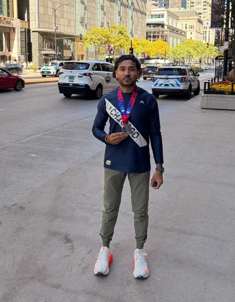 US-Pakistani marathon runner Nizar Nayani displays his medal after finishing the Chicago Marathon. — Reporter