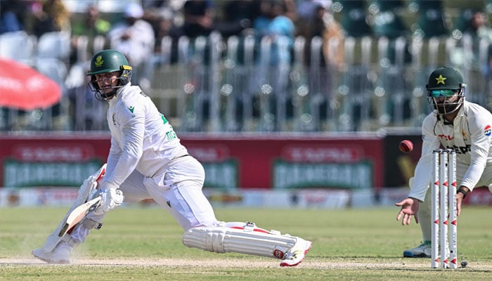 1352981_111055_pindi-2_updates South Africa´s Ryan Rickelton (L) watches the ball after playing a shot during the fourth day of the second Test cricket match between Pakistan and South Africa at the Rawalpindi Cricket Stadium in Rawalpindi on October 23, 2025. — AFP