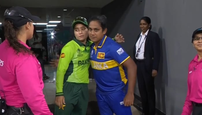 1353321_2781860_icc-world-cup-1_updates Pakistans Fatima Sana and Sri Lankas Chamari Athapaththu embrace after their game is called off due to rain at the R Premadasa Stadium, Colombo, October 24, 2025. — ICC
