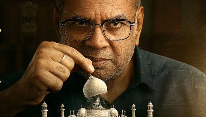 626650_2626370_updates The poster of The Taj Story features Bollywood Paresh Rawal opening the dome of Taj Mahal. — India Today